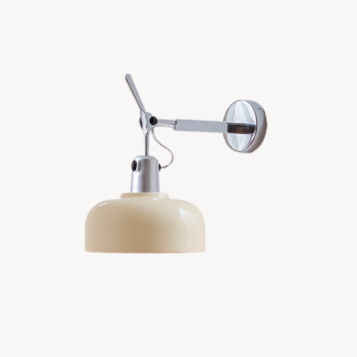 Rosso wall sconce in cream for bedside reading